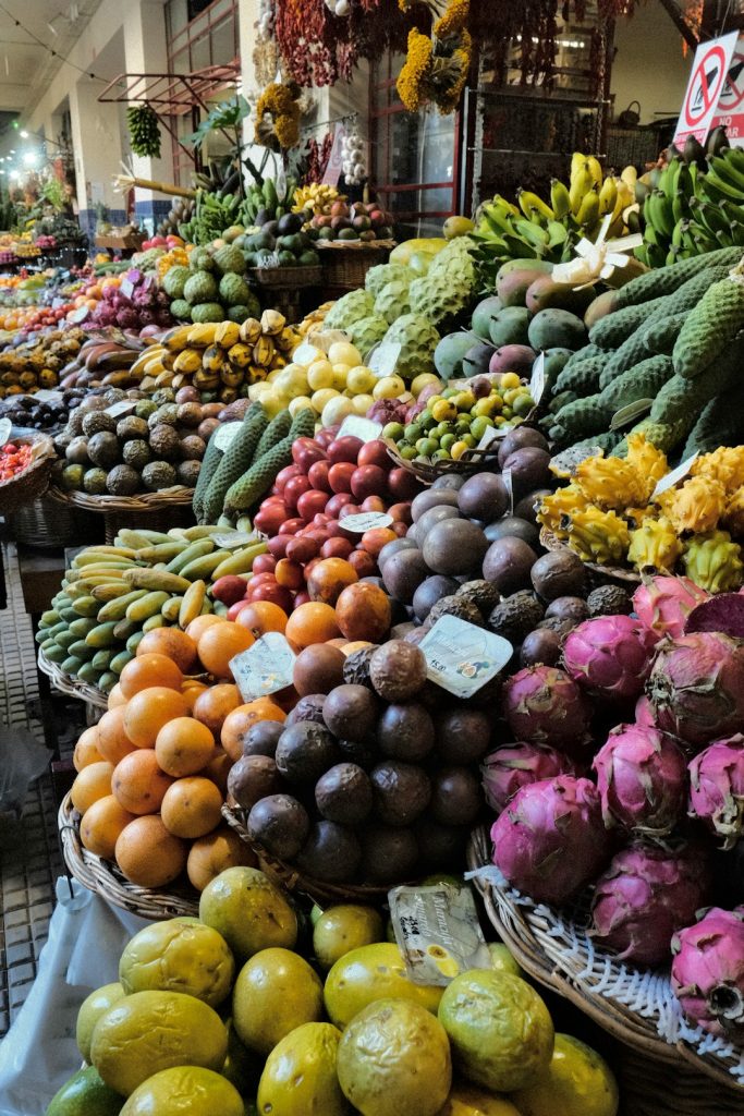 a-large-display-of-fruits-and-vegetables-at-a-market-efg8ljvmjq
